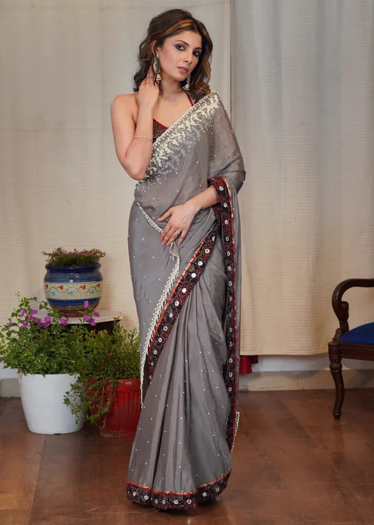 GREY CHIFFON SAREE WITH ELEGANT MOTI WORK AND EXCLUSIVE AJRAKH BORDER WITH MIRROR WORK