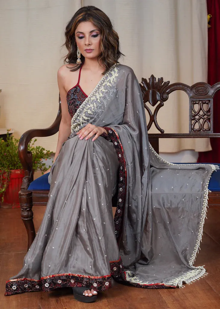 GREY CHIFFON SAREE WITH ELEGANT MOTI WORK AND EXCLUSIVE AJRAKH BORDER WITH MIRROR WORK